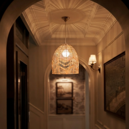 A welcoming rustic Rattanceiling lamp installed in a home entryway.

