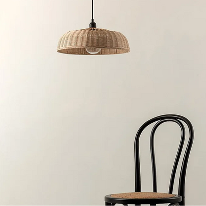 Rustic wicker ceiling pendant fixture with soft glowing light