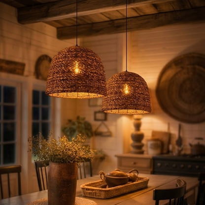 Large rustic woven pendant light hanging above a wooden dining table.