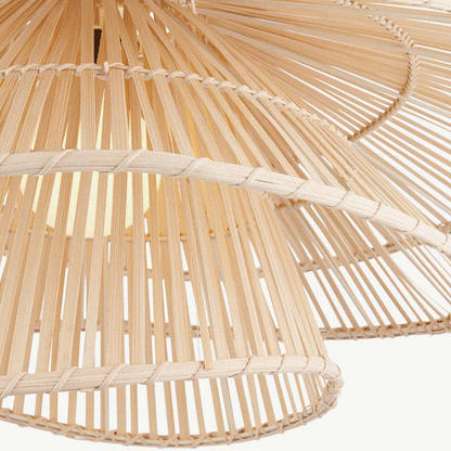 Sculptural bamboo pendant lamp with double-layer flared tiers glowing elegantly in a modern home