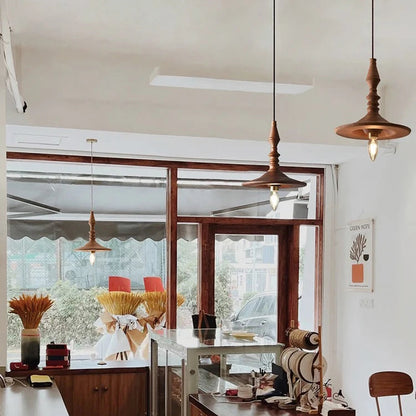 Sculptural lighting featuring natural carved wood, ideal for a stylish restaurant Restaurant And Coffe House, providing mood lighting for dining areas.