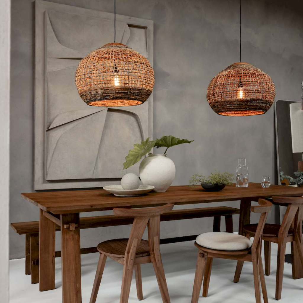 Statement rattan hanging light fixture adding texture to dining areas