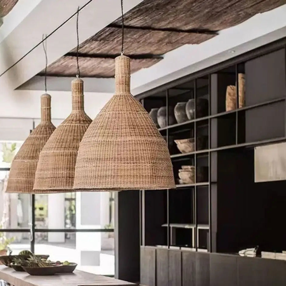 Textured bamboo light fixture illuminating a stylish kitchen island area.