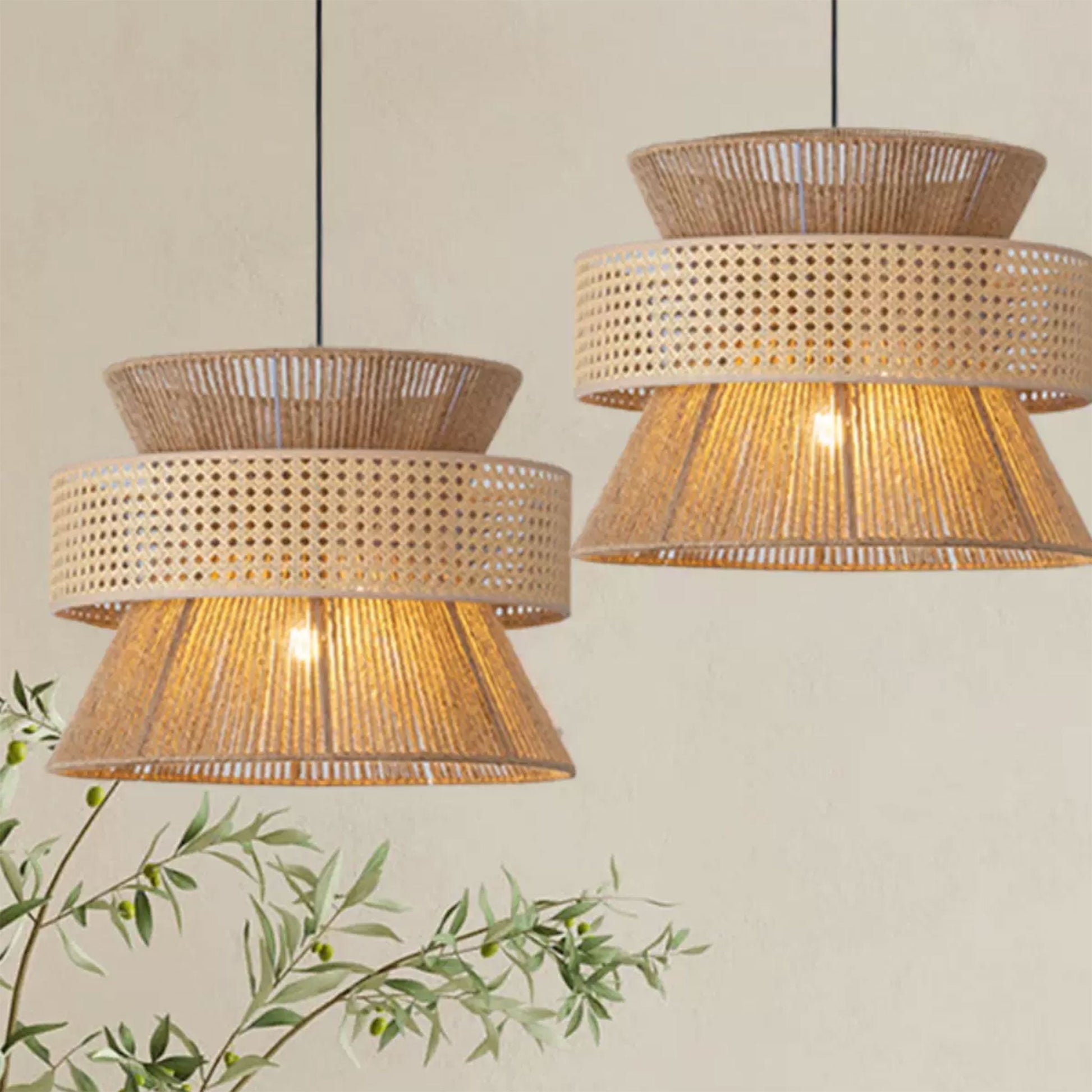 Three tiered rattan chandeliers with cane webbing belts hanging linearly above a luxury concrete kitchen island counter.