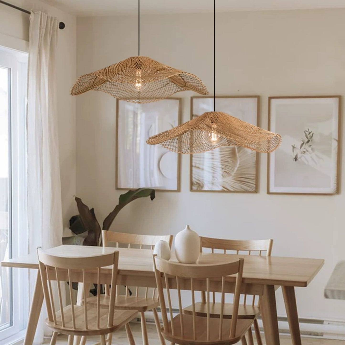 Modern woven mesh floating wave lamp with an artistic curved profile suspended from a clean black cord in a contemporary kitchen.