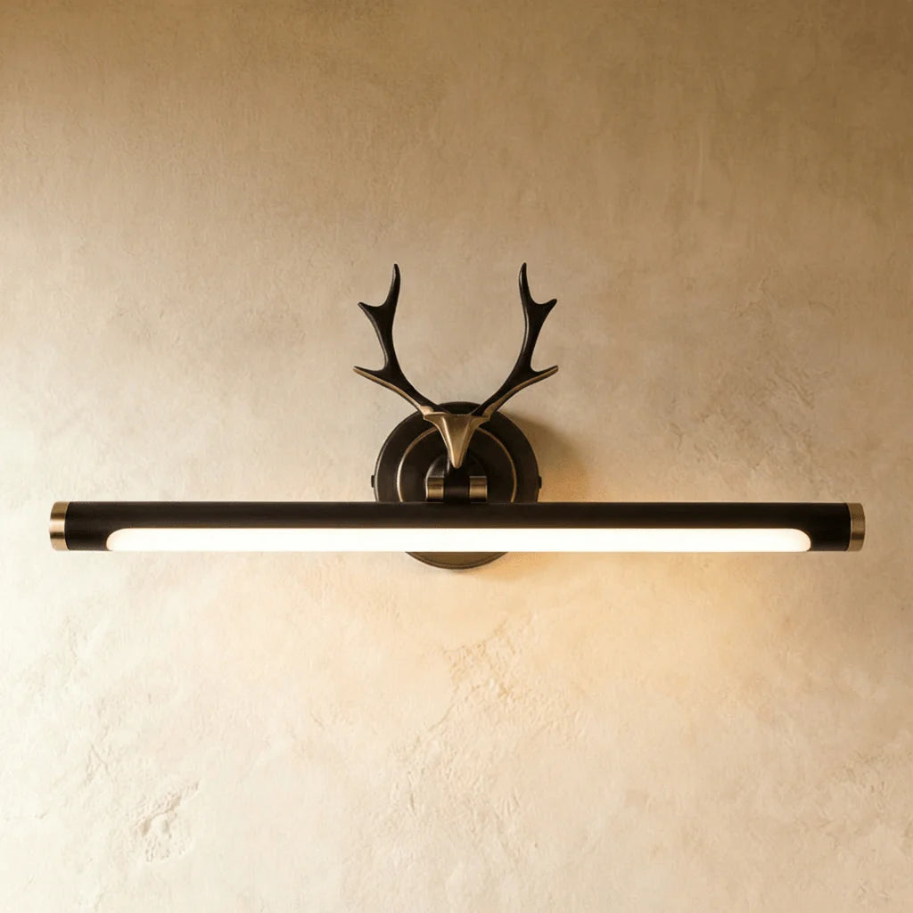 Vintage inspired copper antler picture sconce providing elegant illumination for framed art pieces