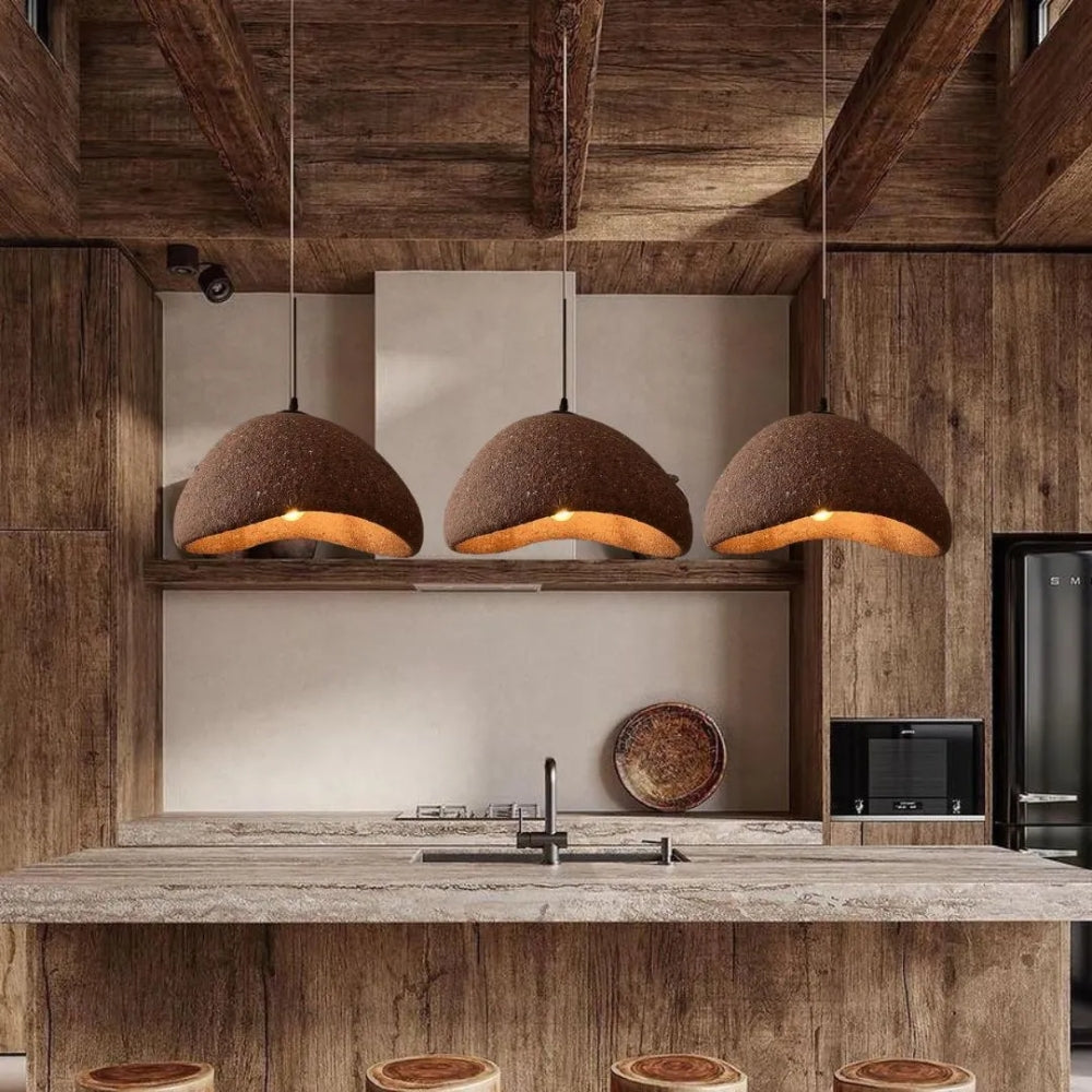 Organic pebble-shaped pendant light over a modern kitchen island