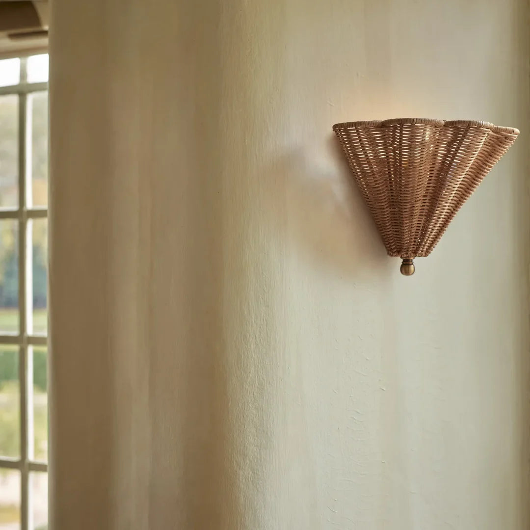 Wall fixture in Japandi style, crafted from rattan, offering sophisticated mood lighting for upscale interiors.