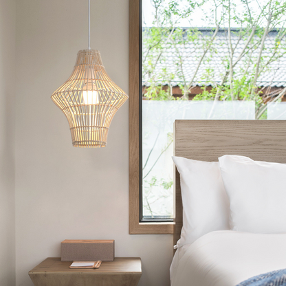 Natural handwoven rattan pendant lamp adding a warm, calming glow to a modern bedroom