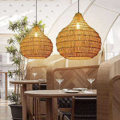 Artisan handwoven seagrass bell pendant light creating a sophisticated and warm ambiance for restaurant dining areas