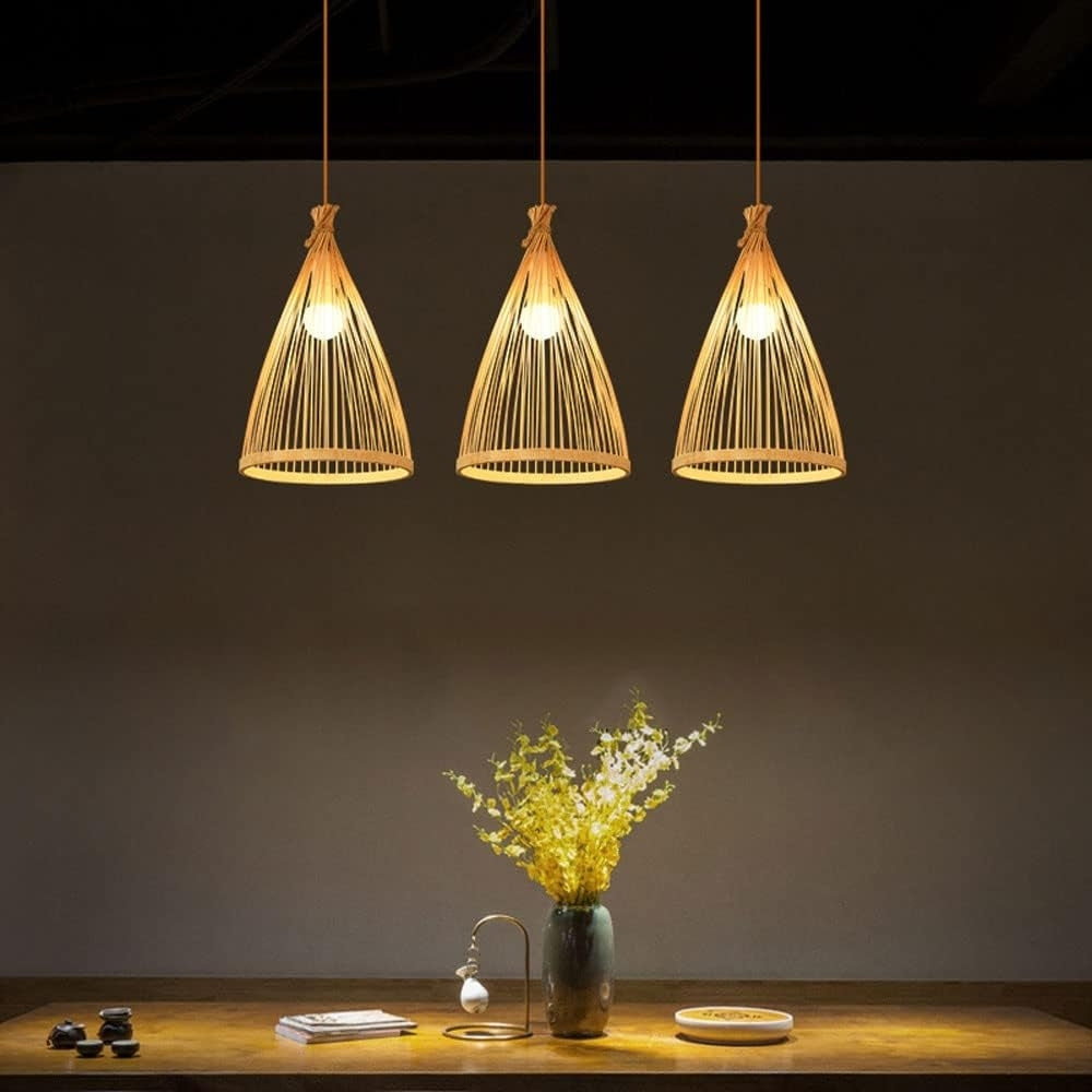 Zen aesthetic bamboo pendant light hanging in a dining room setting