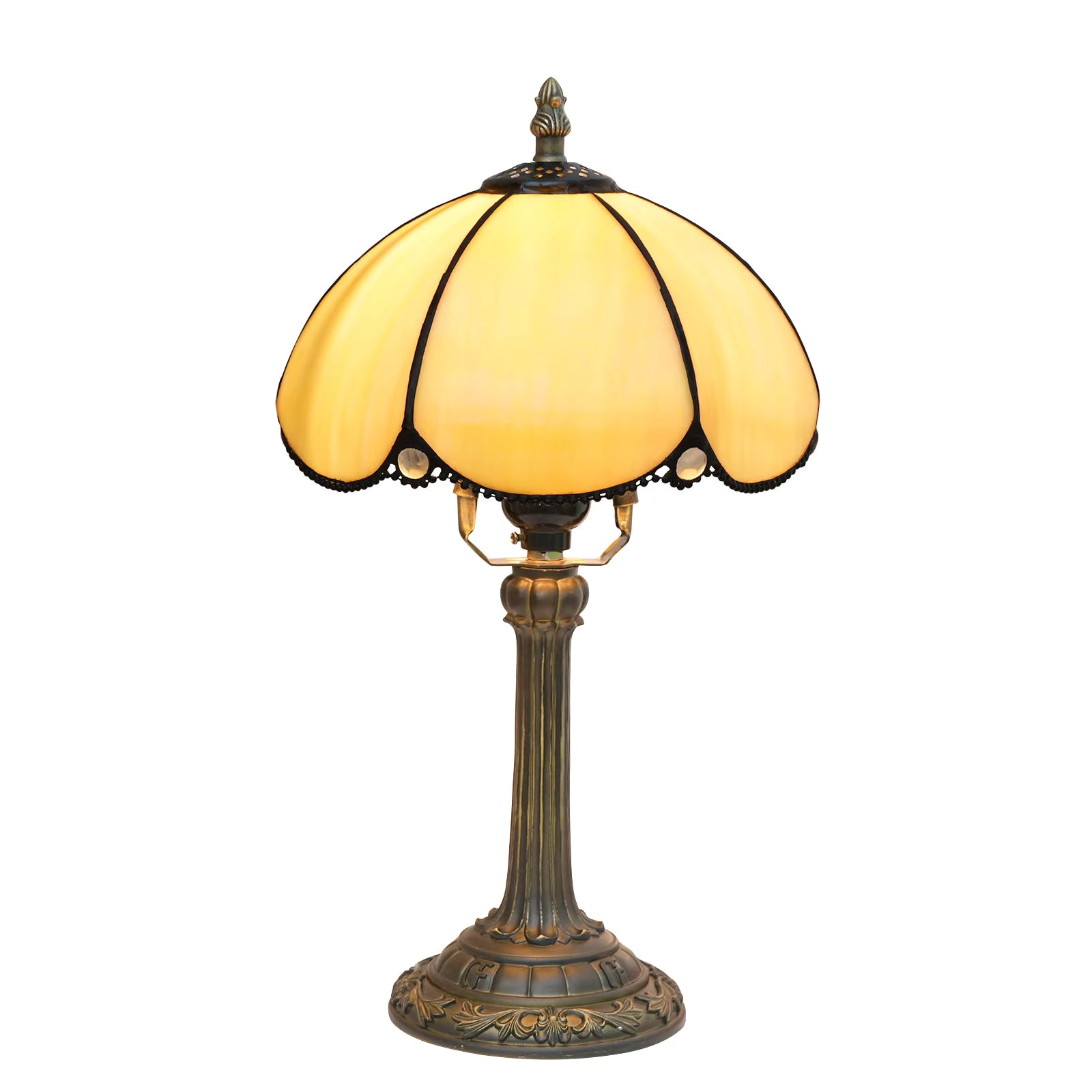 Artistic amber shade Tiffany bedside table lamp casting a warm, glowing illumination for cozy master bedroom nightstands.
