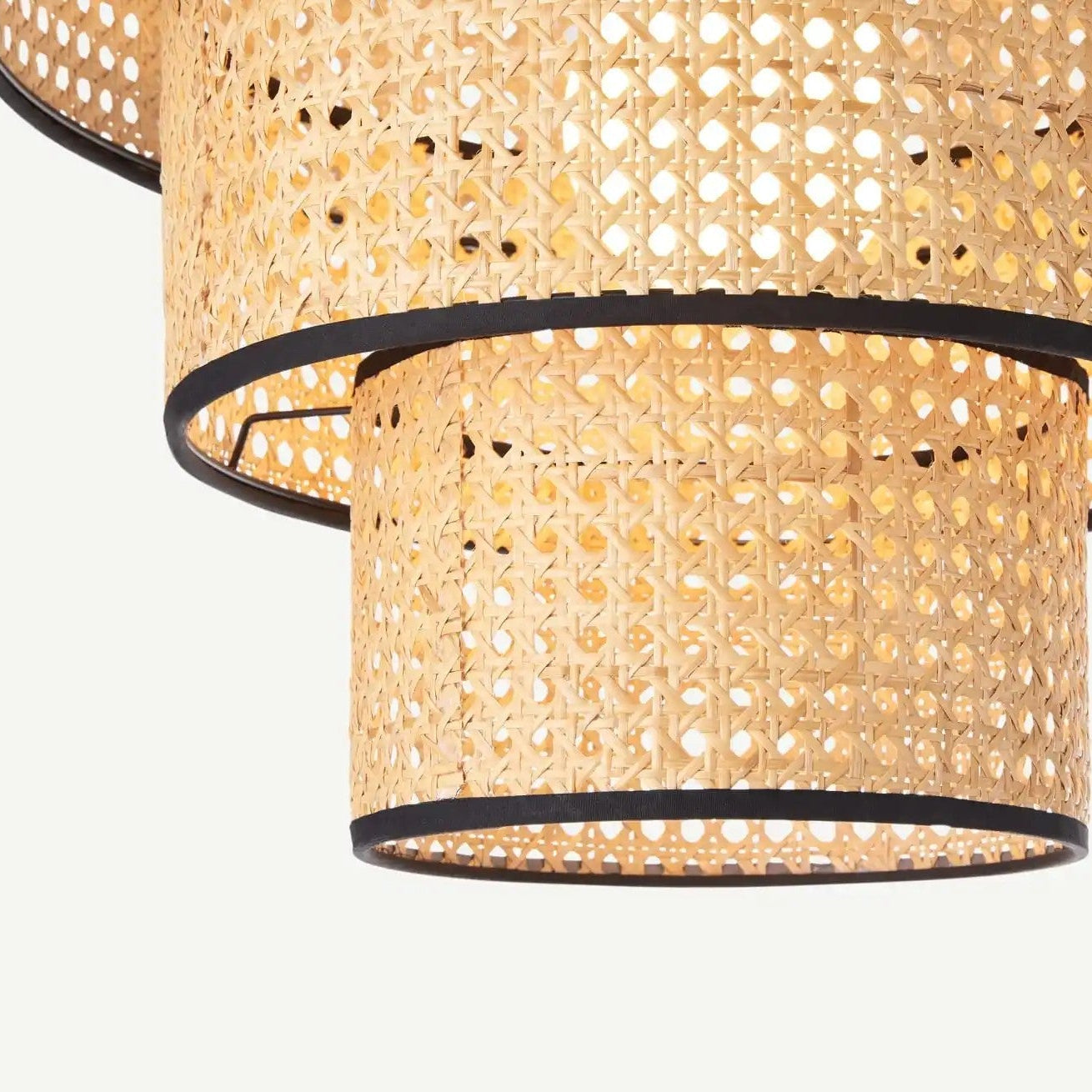 Eco-friendly 3-tier rattan light for sustainable modern lighting.