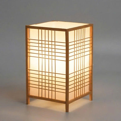 Eco-friendly shoji grid table lamp casting a warm, welcoming glow ideal for living room side tables and modern spaces.