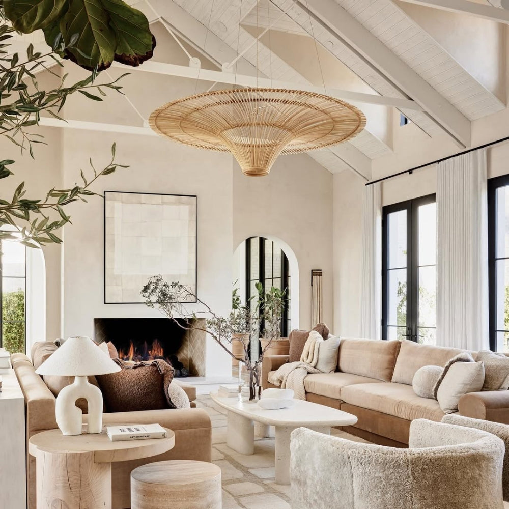 Handwoven bamboo weaving hanging light adding a rustic charm to a coastal homestay living area