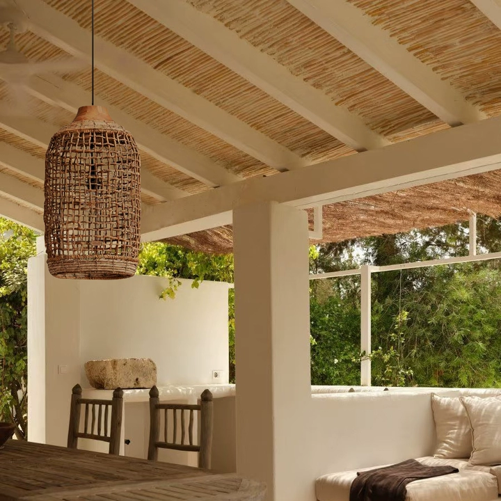 Scandinavian style pendant light in natural rattan cylinder, designed for a modern living room.