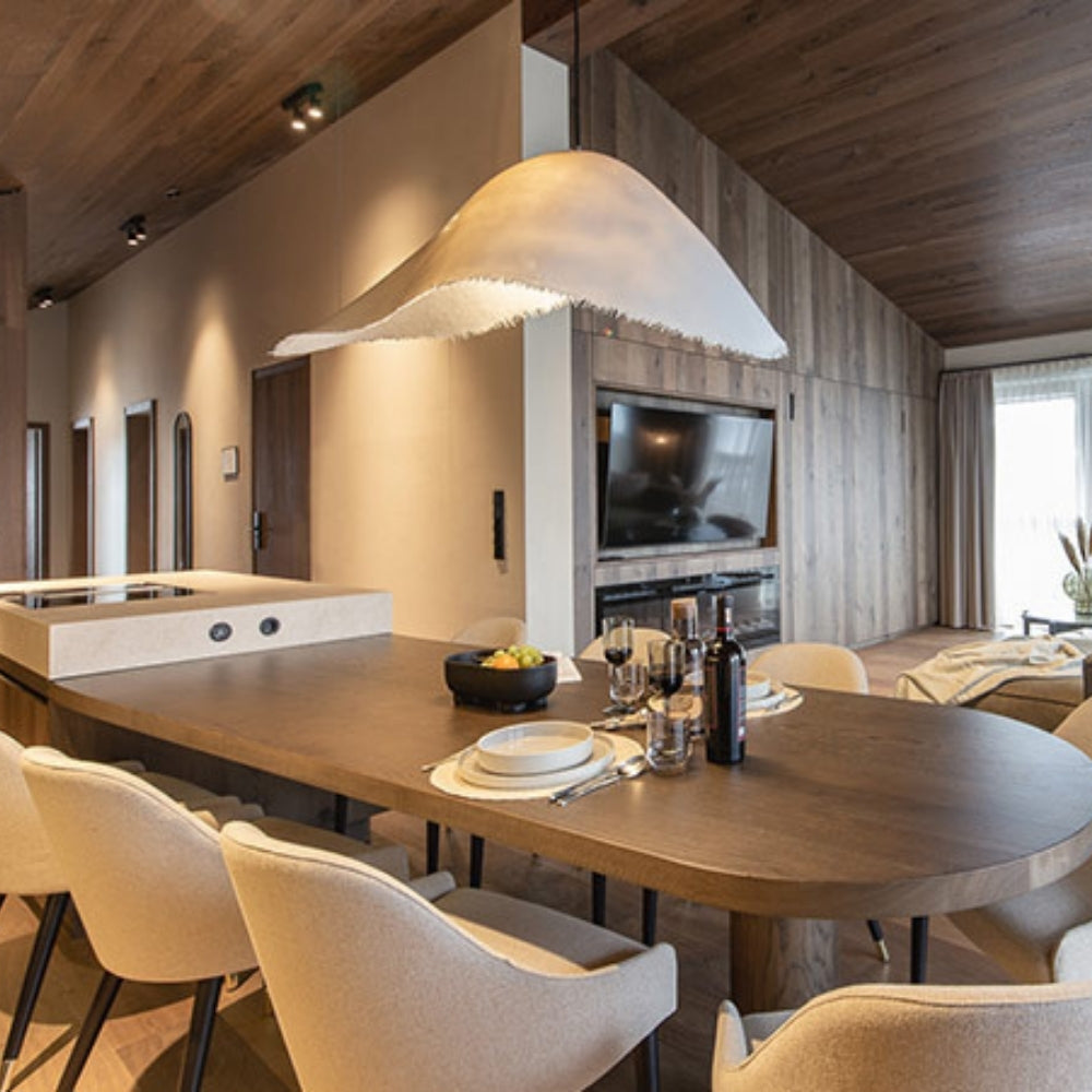 Contemporary artistic hanging light with frayed edge accents