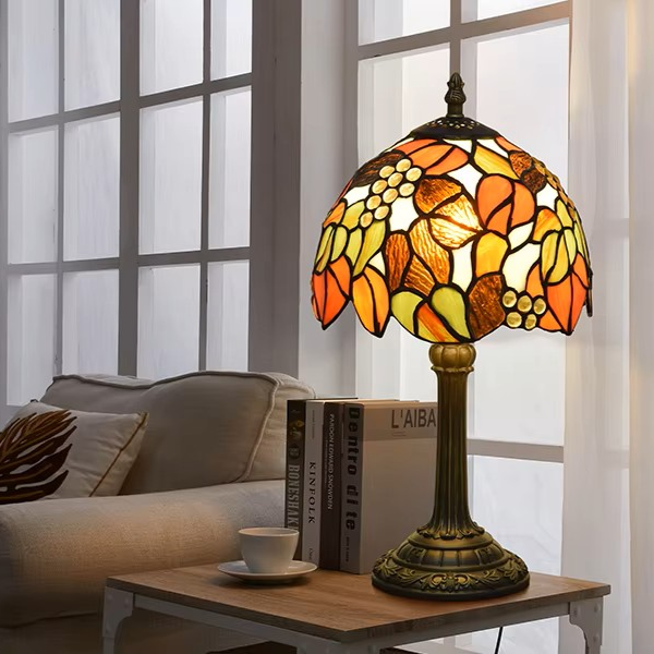 Decorative stained glass lamp featuring a playful botanical fruit motif, ideal for unique bedroom aesthetics.