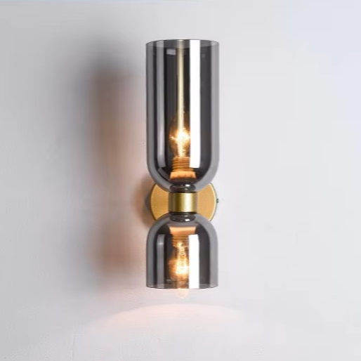 Art decor inspired copper and glass drop light serving as a striking architectural accent in a home hallway.