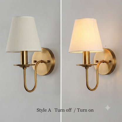 Quiet luxury lighting style iron and cloth wall drop light providing graceful guiding illumination along stairs.