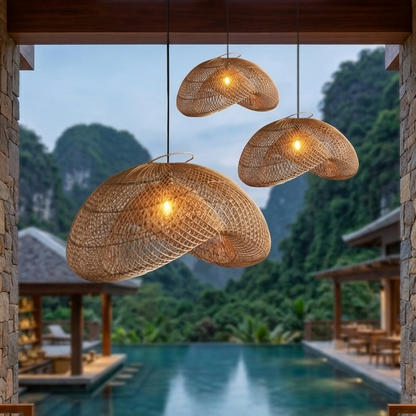 A stylish handwoven rattan pendant light with a modern black ceiling mount.