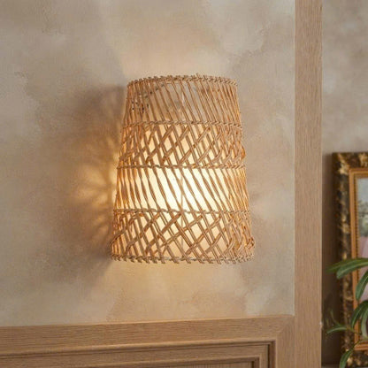 Handmade eco-friendly natural rattan wall sconce crafted from sustainable plant fibers for a healthy living room.