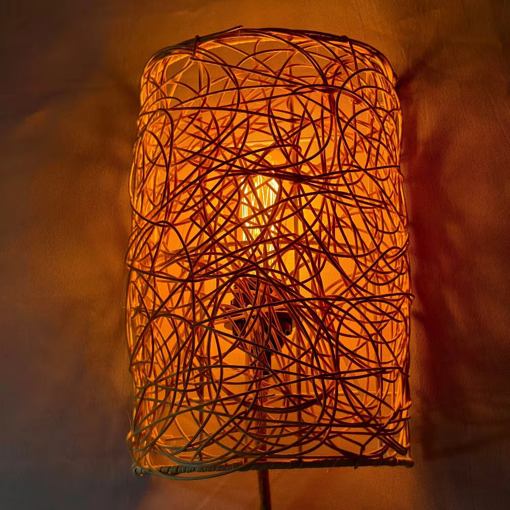 Neoclassical natural rattan wall sconce blending intricate tangled textures with elegant architectural living room decor.