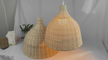 A classic handwoven rattan pendant light with a clean white ceiling fixture.