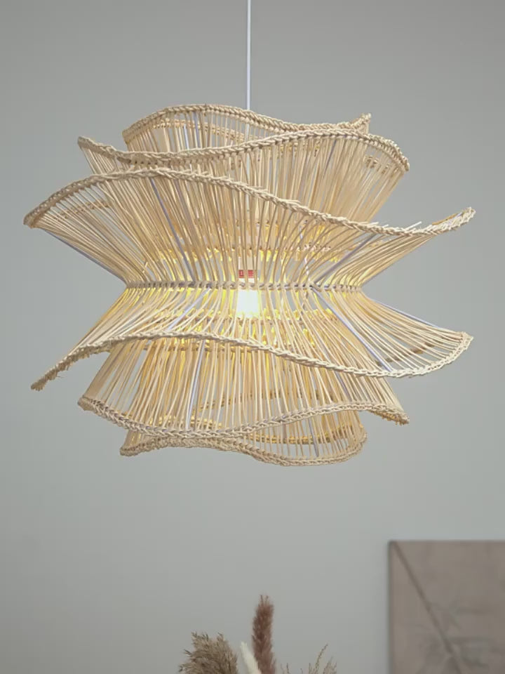 Eco-friendly natural fiber pendant lamp in a wavy, flower-like silhouette for coastal and boho decor