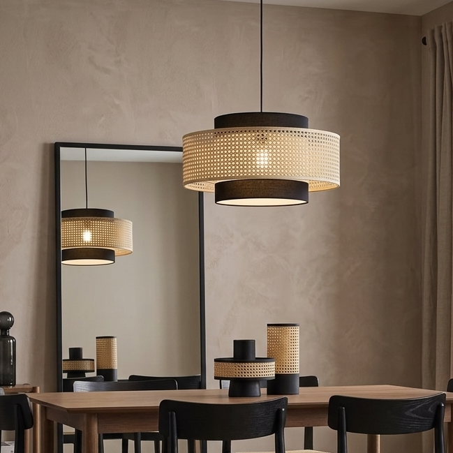 Rattan pendant light hanging over a modern dining table