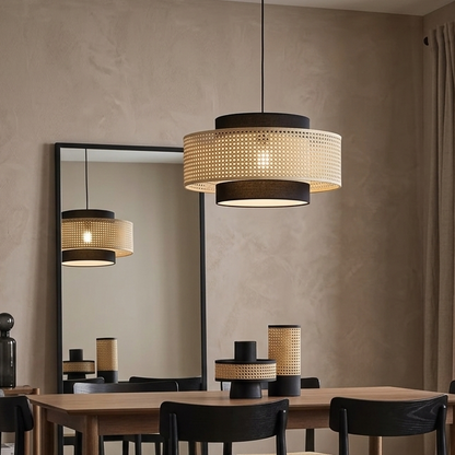 Rattan pendant light hanging over a modern dining table
