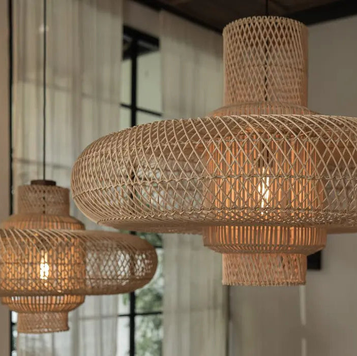 Decorative round rattan basket pendant lighting with intricate woven patterns for farmhouse style.