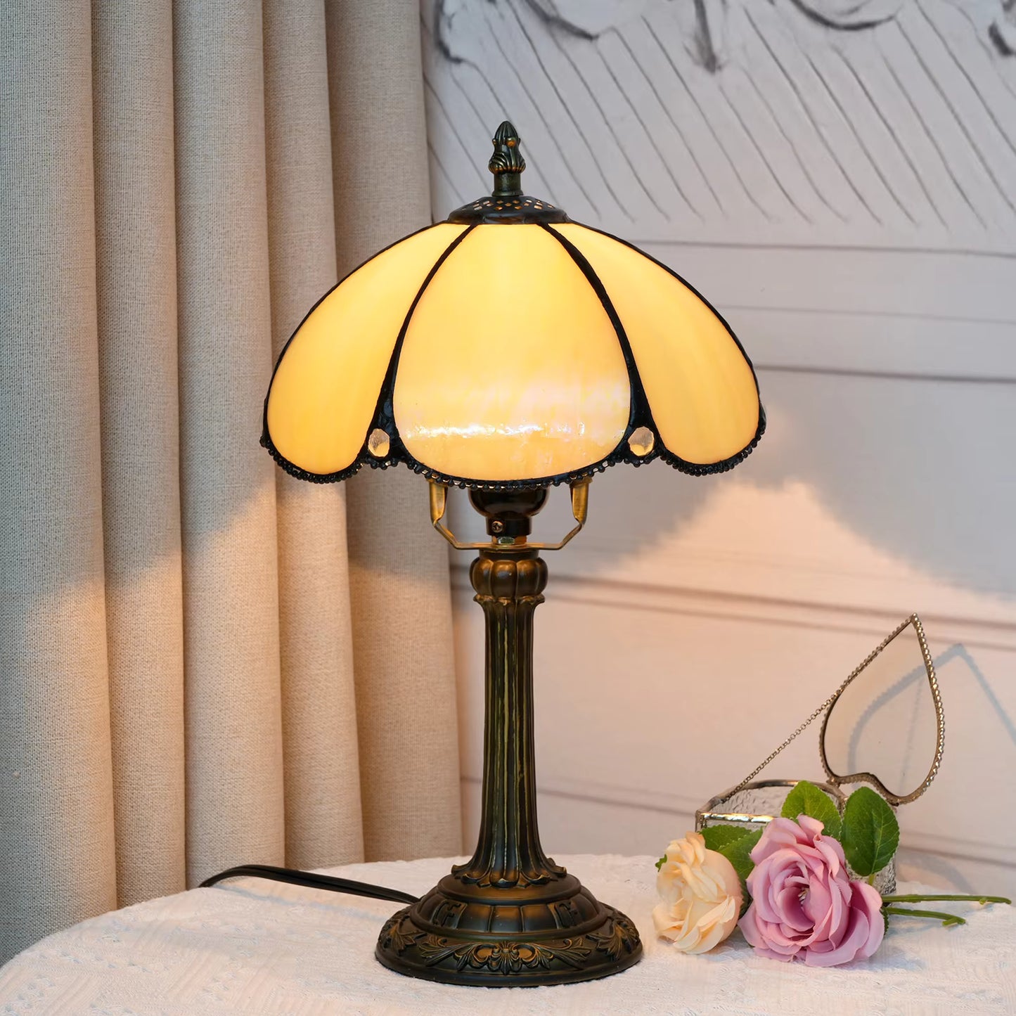 Bohemian style stained glass amber desk lamp with soft yellow panels, adding vintage art-glass decor to study rooms.