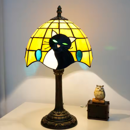 Bohemian style stained glass cat desk lamp with rich colored panels, adding whimsical art-glass decor to study rooms.