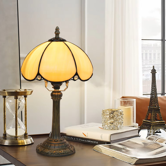 Handcrafted stained glass table lamp bringing soft, elegant amber character and gentle illumination to home office workspaces.