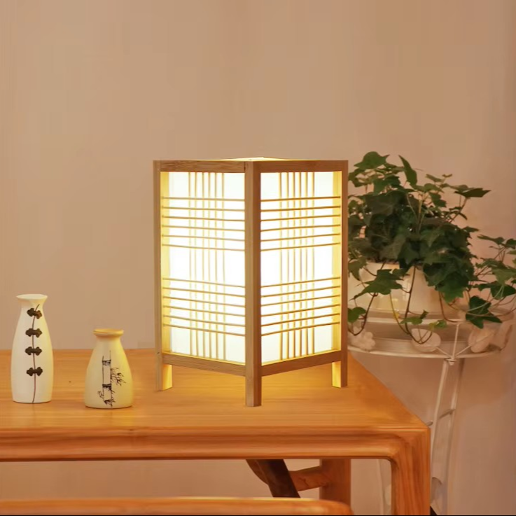 Sustainable wood and paper shoji table lamp adding organic warmth and soft accent lighting to low coffee tables.