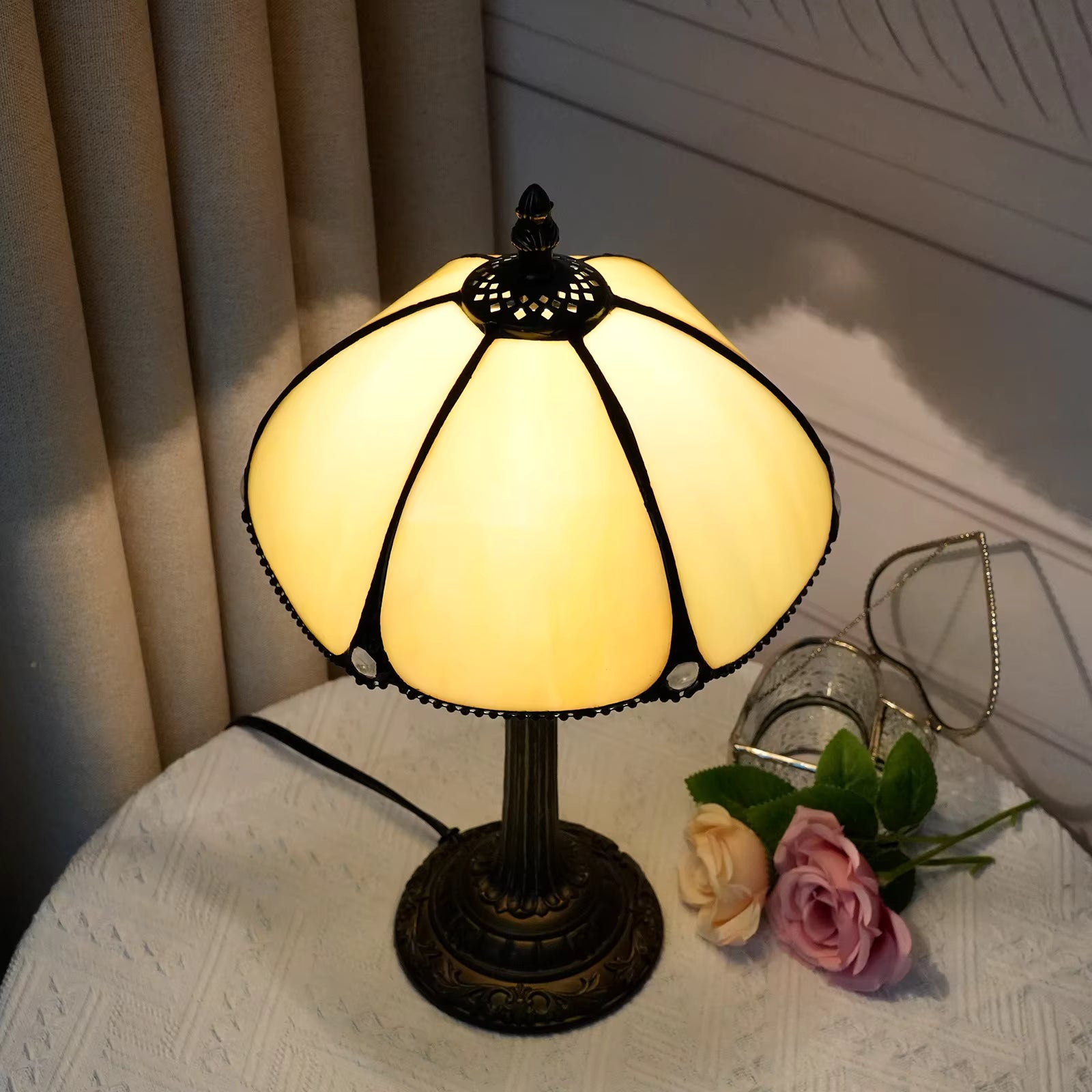 Unique stained glass desk lamp with a warm amber glow, casting delightful cozy light over reading nooks.