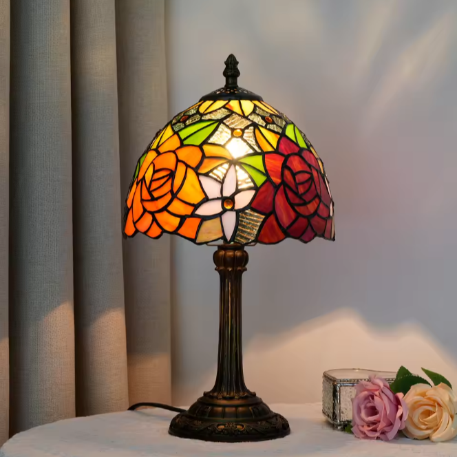 Unique stained glass desk lamp with a whimsical grape theme, casting delightful colored light over reading nooks.