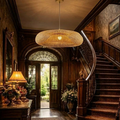 A stylish woven bamboo pendant light fixture hanging in a luxury vintage hallway, featuring warm ambient lighting and elegant interior design.